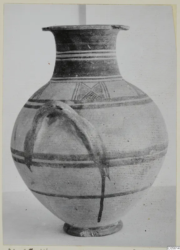 White Painted I amphora with dark painted bands, a lattice motif on the shoulder and a strap handle