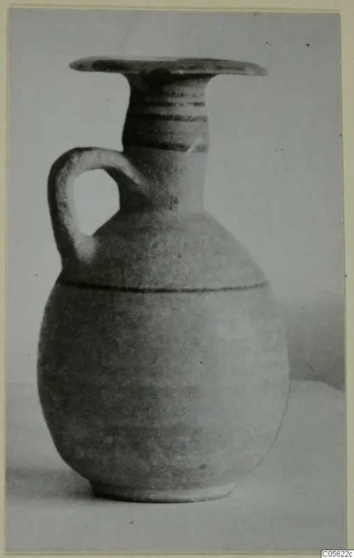 Jug from Amathus with a flaring rim, one loop handle and dark bands on the neck and body.
