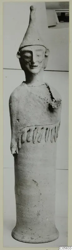 Terracotta figure with a tall conical head and a cylindrical body on a flaring base, photographed upright