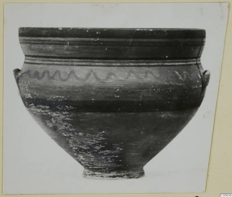 Pottery bowl with a wavy painted line on the upper body and two small handles at the shoulder