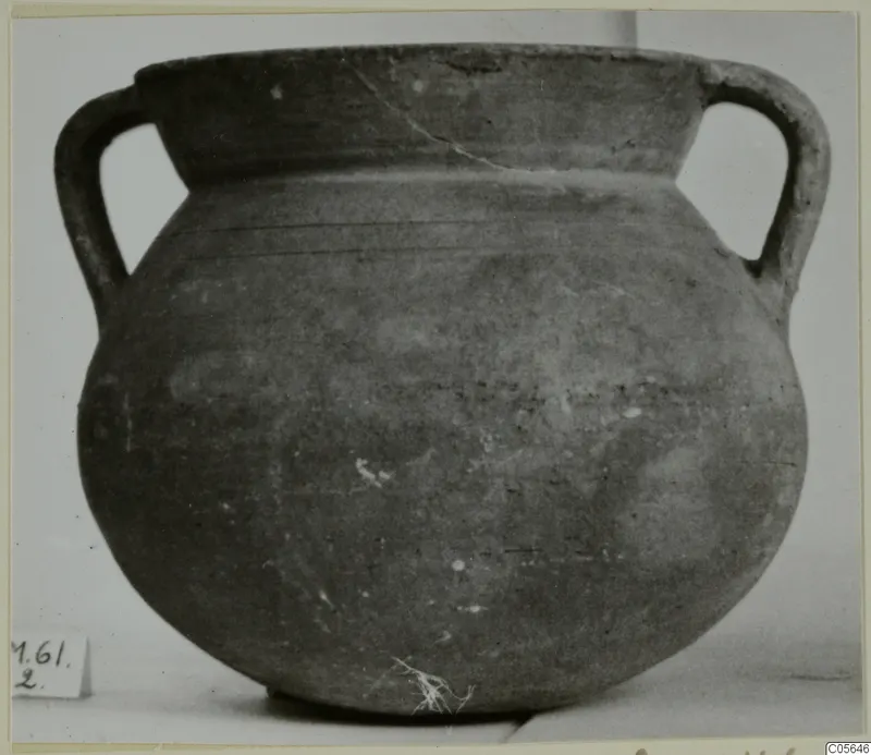 Coarse ware cooking-pot with two handles, shown on a plain background.