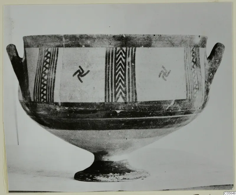 White Painted I bowl with two horizontal handles and a footed base, decorated with banded panels and hooked motifs