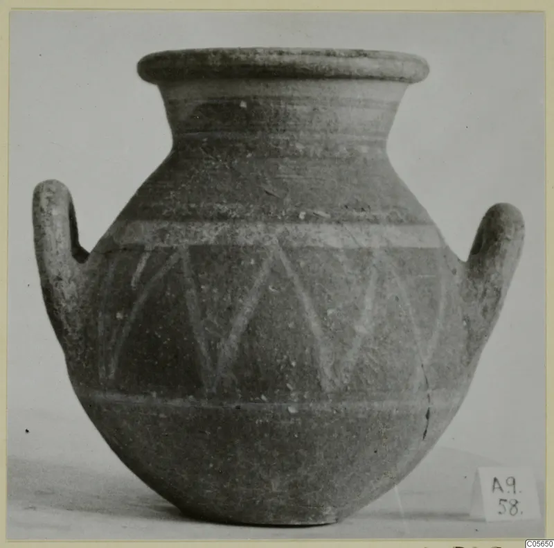 Two-handled pottery jar with a painted band of diagonal strokes, from Amathus