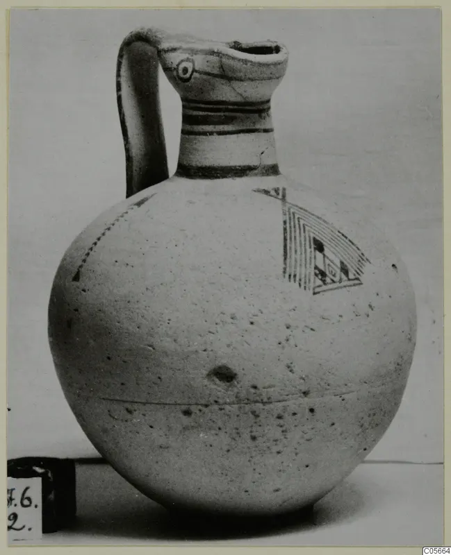 Pottery Bichrome III jug with a strap handle and painted bands