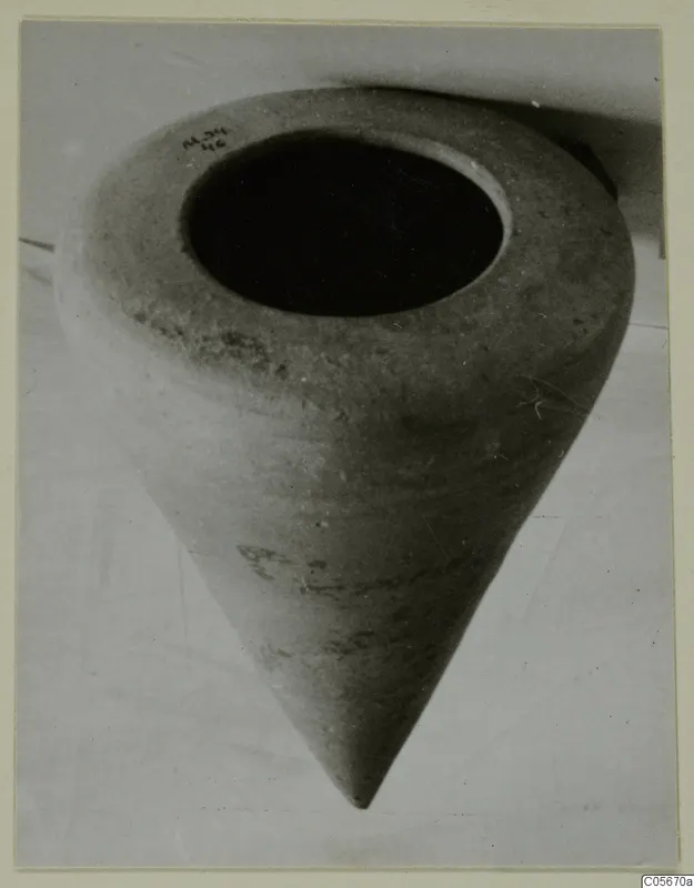 Pottery Plain White VII jar with a wide open mouth and a pointed base, photographed mouth-up on a pale surface
