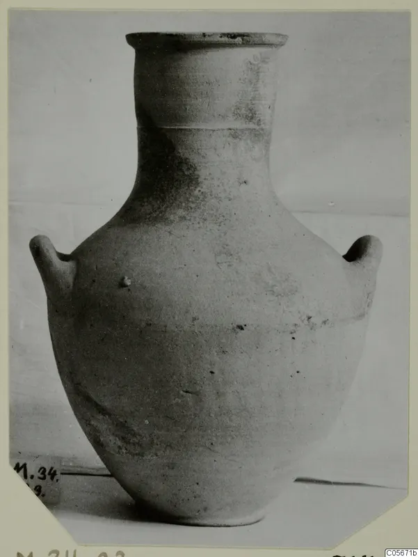 Pottery Plain White VII amphora from Marion, with two handles and a tall neck, photographed against a plain backdrop.