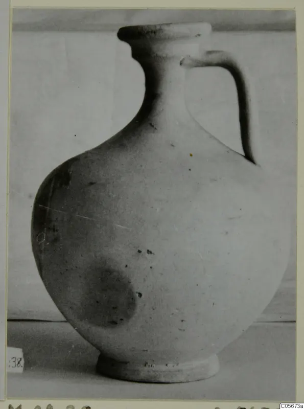Pottery Plain White VII jug with a single strap handle and a flat-topped rim, seen from the side.