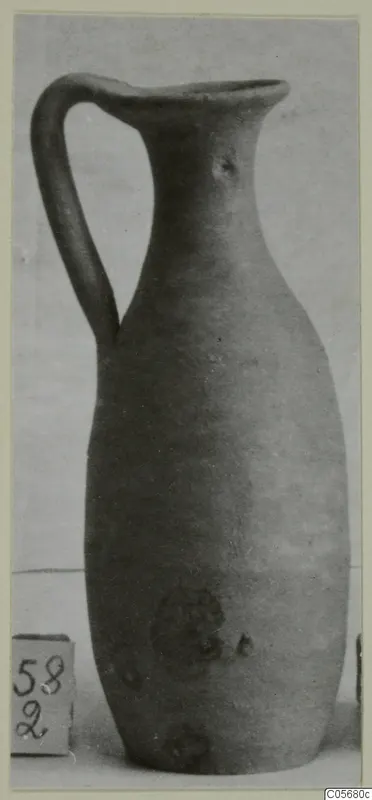Plain White VI jug with a single strap handle, a tall narrow neck and a rounded body, shown against a light backdrop.