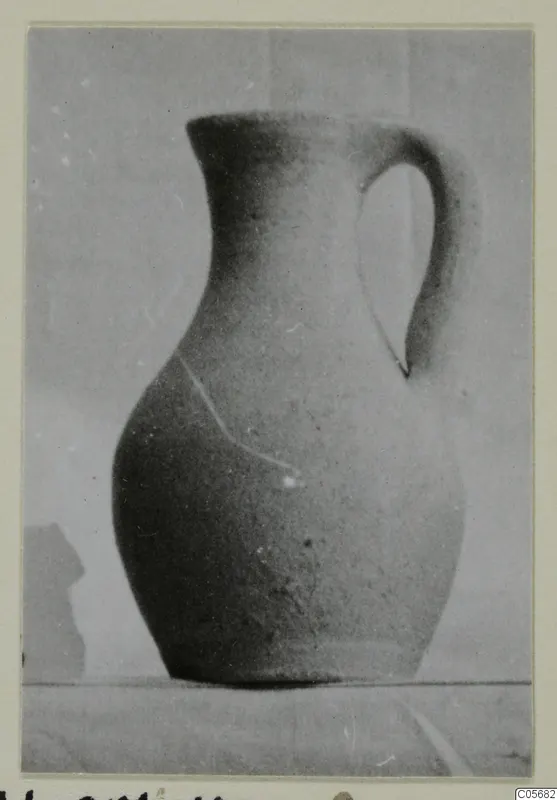 Pottery Plain White VII juglet from Marion, with a single loop handle, photographed against a plain backdrop.
