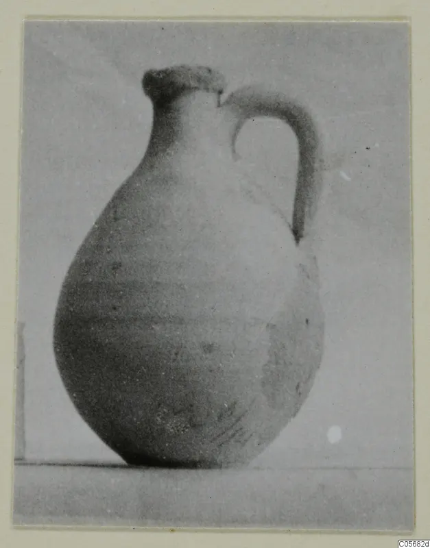 Pottery juglet with a single handle, Plain White VI, shown against a plain background