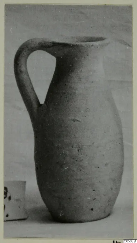 Pottery jug, Plain White VI, with a single loop handle, photographed against a pale background.