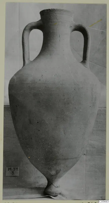 Pottery Plain White VII amphora with two handles and a pointed base, against a plain backdrop.