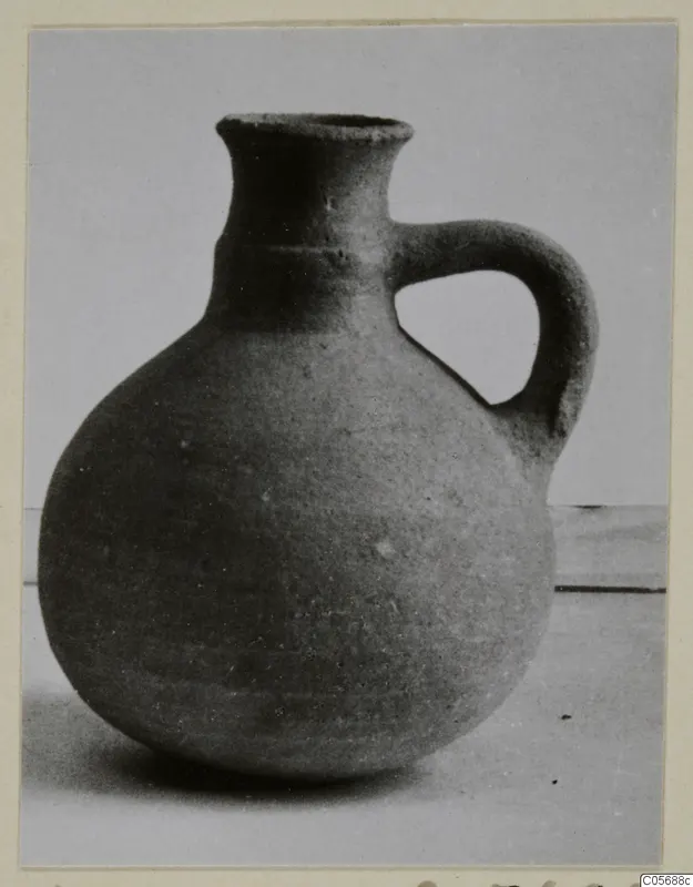 Pottery Red Slip jug from Amathus tombs 10–26, with a round body and a single loop handle.