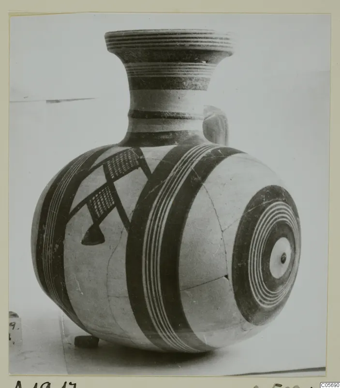 White Painted I jug from Amathus with banded and concentric circle decoration on a globular body.