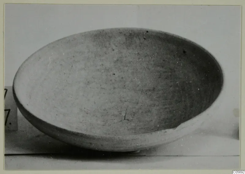 Pottery Plain White I-III bowl, shallow and pale, seen from above at an angle against a light background