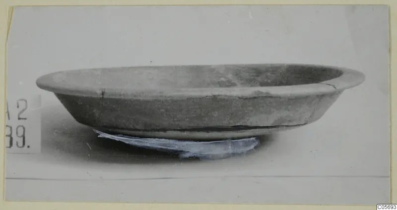 Shallow bowl with a wide rim, photographed on a plain background; find from Amathus tombs 1–9