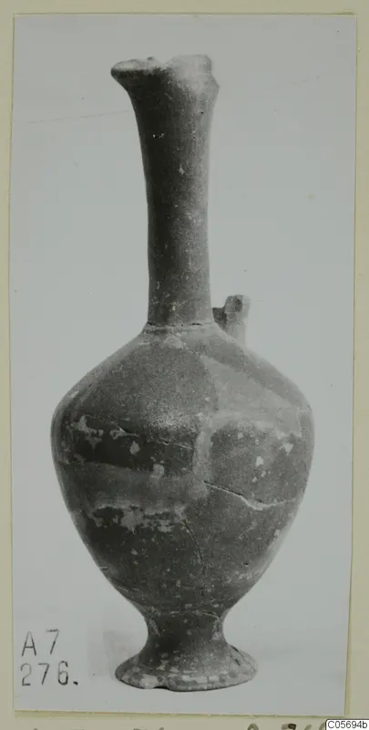 Jug with a tall narrow neck and rounded body from Amathus, shown on a plain background