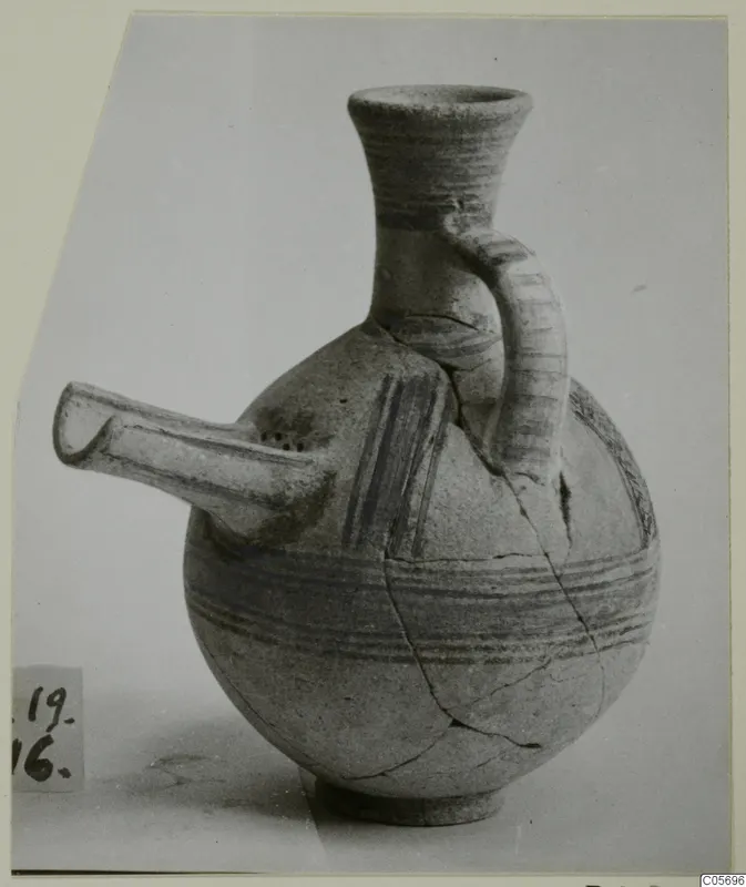 Pottery Bichrome II strainer vessel from Amathus, with a tubular spout and painted bands