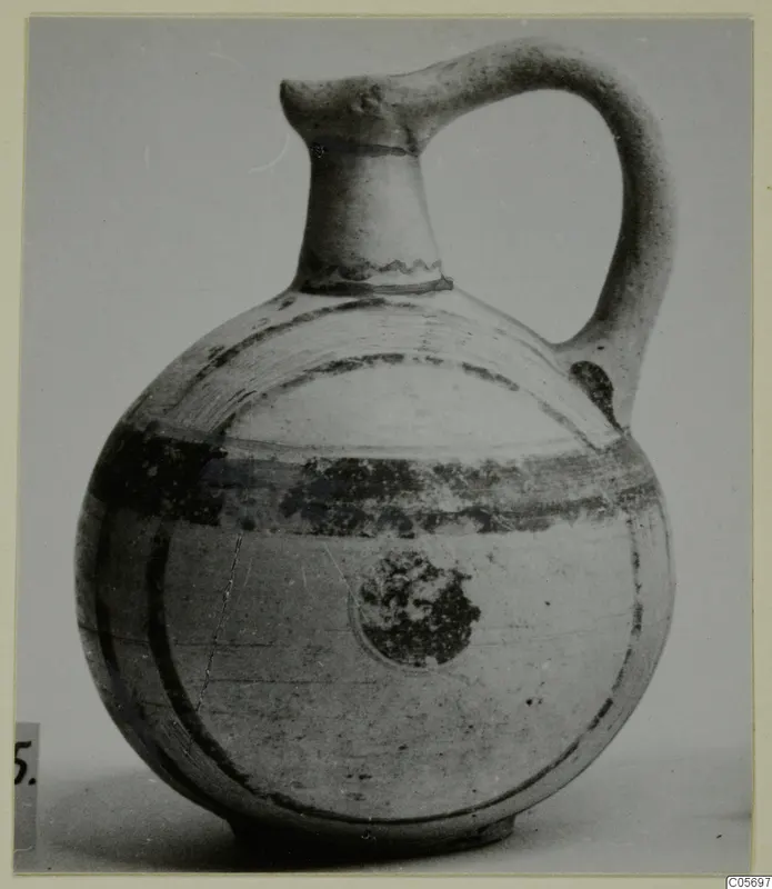 Jug in Pottery Bichrome V from Amathus, with a single strap handle and dark painted bands