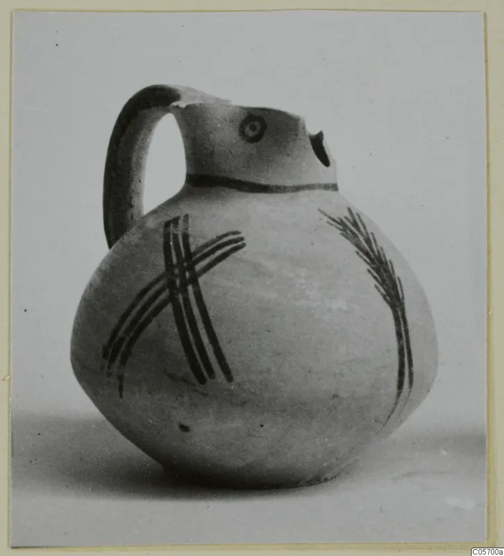 Jug in White Painted IV ware from Amathus, with a strap handle and dark painted bands on a pale body
