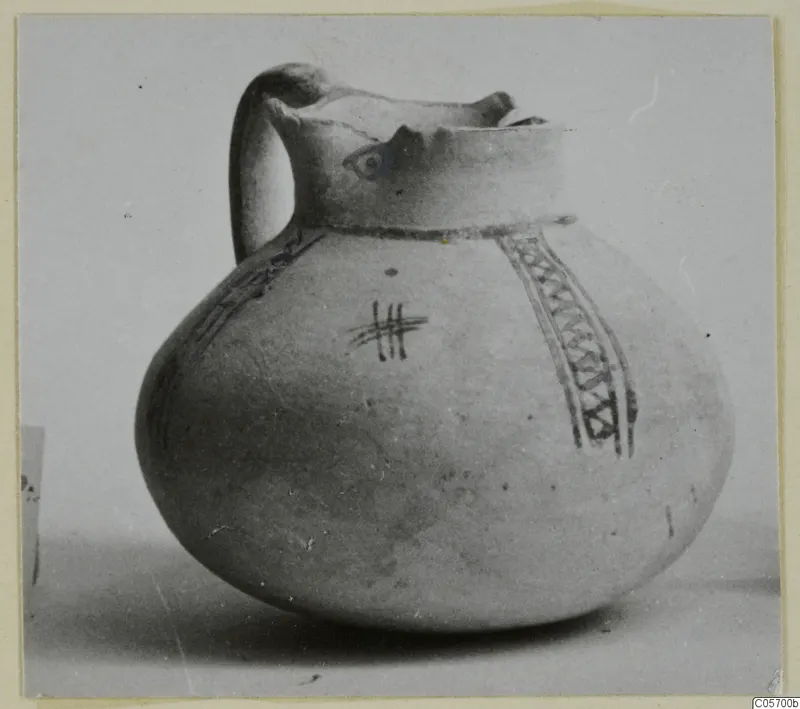 White Painted IV jug from Amathus with a single loop handle and painted bands on a globular body