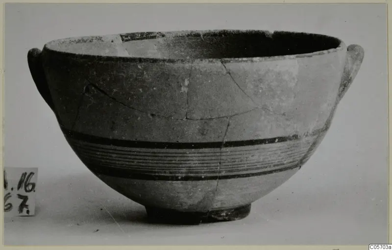 Bowl from Amathus in Black-on-Red I-III ware, with dark horizontal bands around the body and small handles at the rim.
