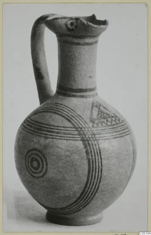 Painted jug with one handle, dark bands, concentric circles and a hatched triangle, from Amathus tombs