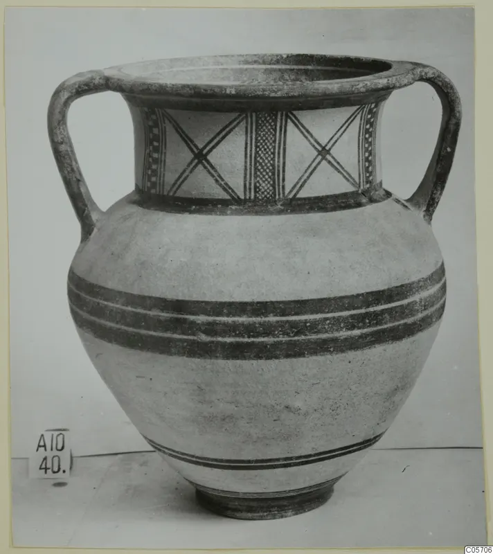 White Painted II two-handled vessel from Amathus, with dark painted bands on the body and criss-cross panels on the neck