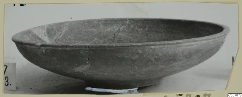 Shallow bowl with a flaring rim and low foot, side view, from the Amathus tombs 1–9 finds.
