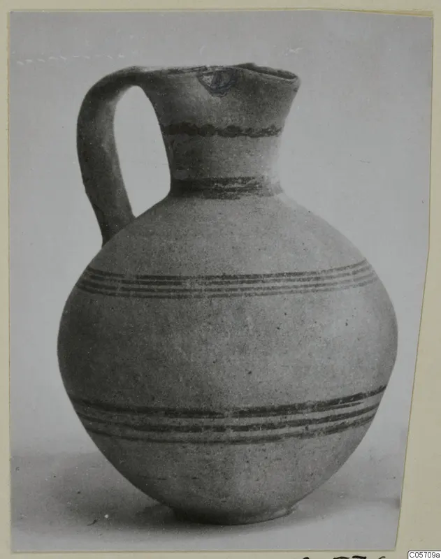 Pottery White Painted III-1 jug with a single handle and dark painted bands, from Amathus