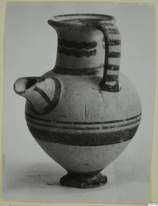 White Painted II jug from Amathus, tombs 10–26, with wavy neck bands and a striped strap handle