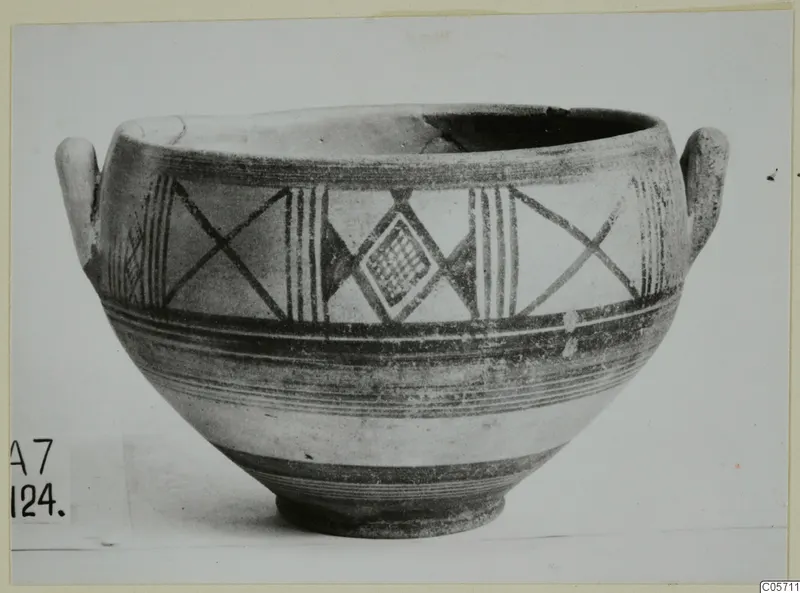 Pottery bowl with two small handles and painted bands, crossed-line and lozenge motifs, from Amathus tombs 1–9 finds
