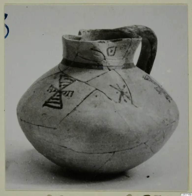 Pottery Bichrome IV jug from Amathus, with dark painted triangles and motifs on a rounded body