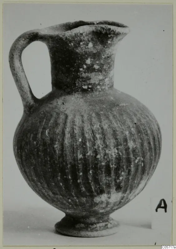 Black Slip jug from Amathus with a loop handle and vertical grooves on the body
