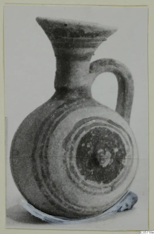 Small jug with a flaring mouth, one loop handle and dark painted bands, from Amathus tombs 10–26