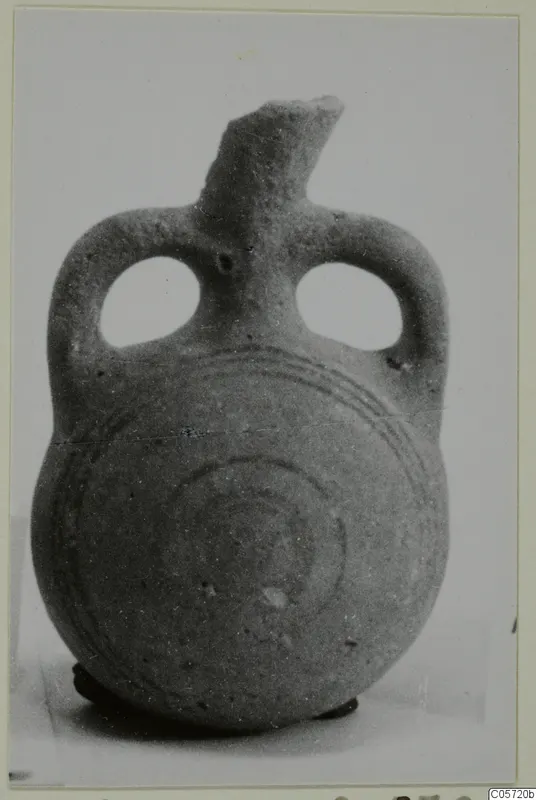 Small bottle with two loop handles and dark concentric circles painted on the body, from Amathus