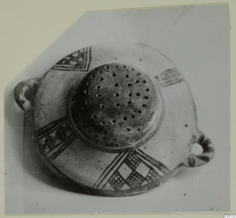 White Painted I bowl from Amathus with two loop handles, a perforated central element and dark painted bands