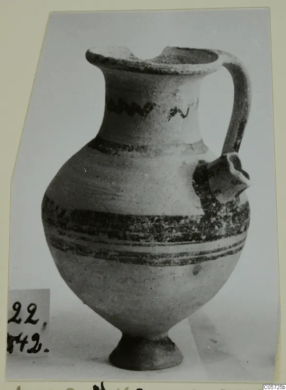 White Painted I jug from Amathus with painted bands on the body and a wavy motif on the neck