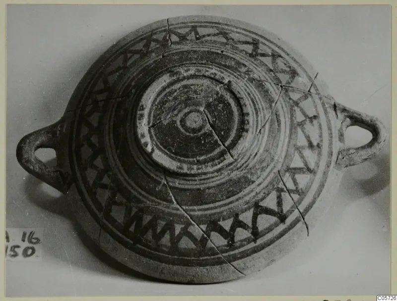 Pottery Bichrome III bowl from Amathus, shallow with two loop handles and dark painted zigzag bands around the rim