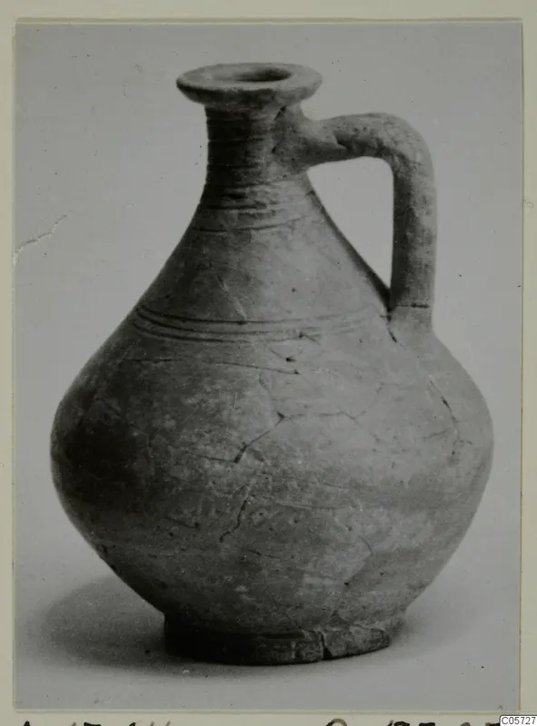 Pottery jug with a single strap handle, a flared mouth and incised lines on the body, from Amathus