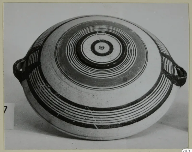 Pottery Bichrome III flattened vessel with concentric circle decoration and two loop handles