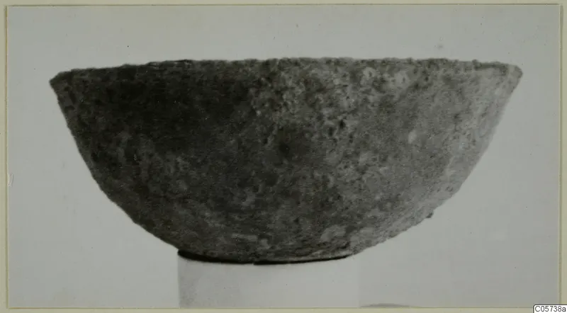 Bowl from Marion, shown in side view on a plain stand.