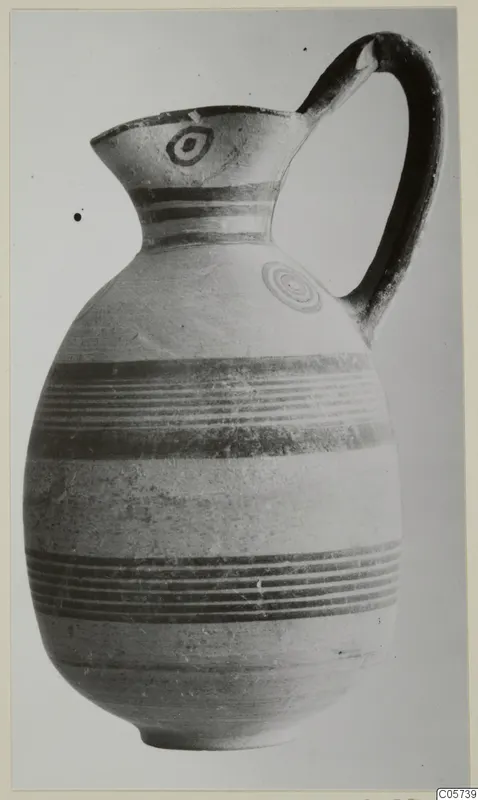 Juglet with a single handle, painted horizontal bands and ring motifs on the rim and shoulder