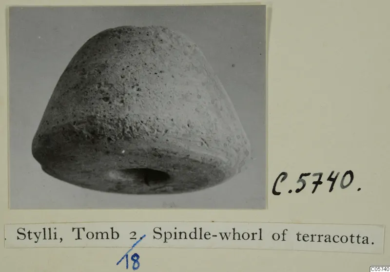 Spindle-whorl of terracotta from Stylli Tomb 2, shown on an album card