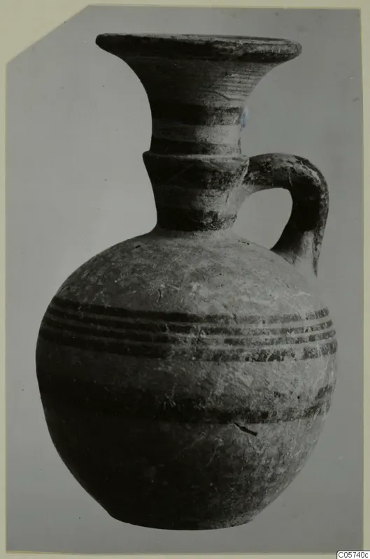 Pottery Black-on-Red I-III juglet from Amathus with a flaring rim, one handle and dark horizontal bands