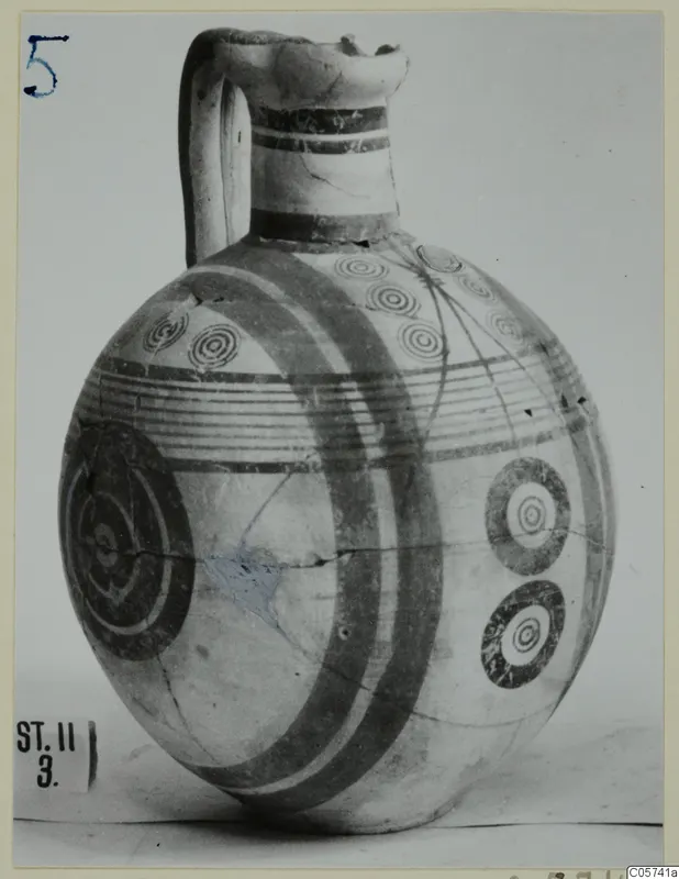 Pottery Bichrome IV jug with a round body, banded paint and concentric circle motifs