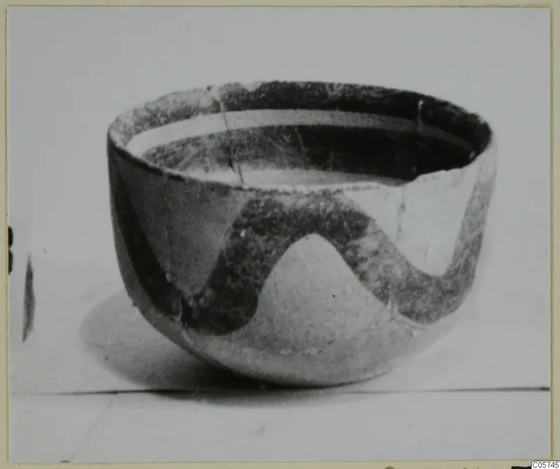 Bowl with a dark wavy painted band on a pale surface, White Painted III-1 pottery