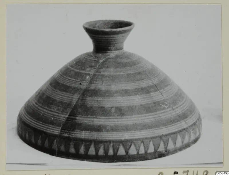 Pottery Bichrome V vessel with a broad conical body, narrow neck and horizontal bands of lines