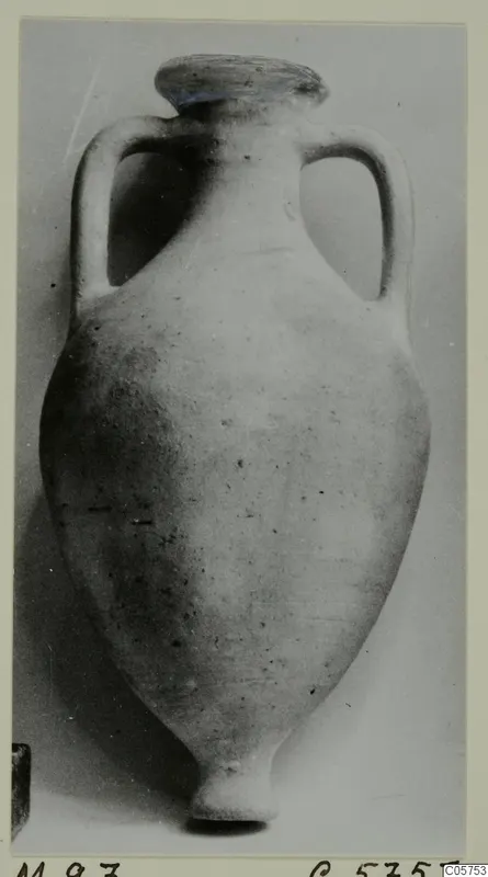 Cypro-Hell.I two-handled pottery jar from Marion, shown upright against a plain grey backdrop