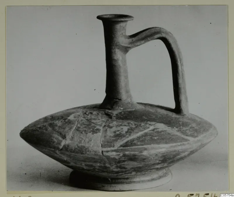 Cypro-Hell. II jug with a tall neck, flaring rim and strap handle, from the Marion tomb finds